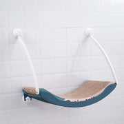 Hanging cat hammock mounted on a wall, perfect for sunbathing and relaxing, made from durable plastic material.