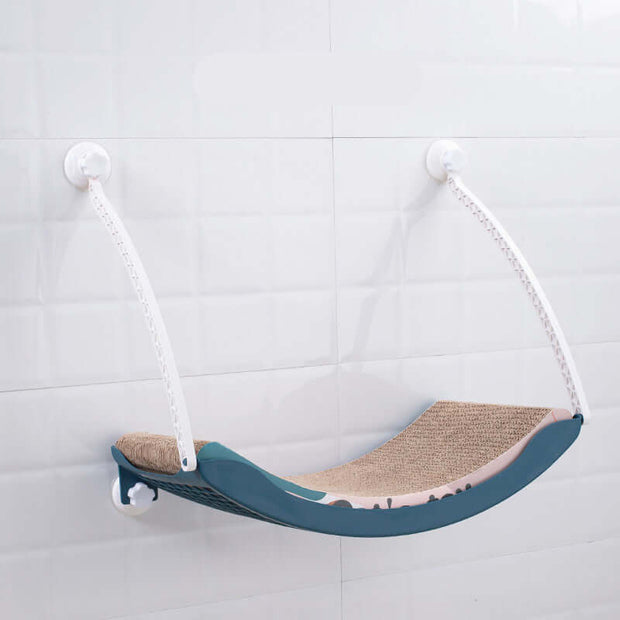 Hanging cat hammock mounted on a wall, perfect for sunbathing and relaxing, made from durable plastic material.