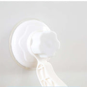 Close-up of a white suction cup with a twist knob, designed for securing a hanging cat hammock on smooth surfaces.