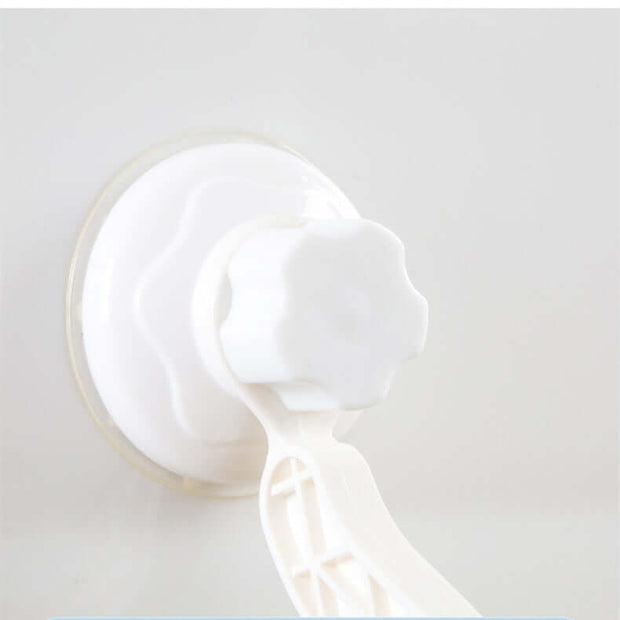 Close-up of a white suction cup with a twist knob, designed for securing a hanging cat hammock on smooth surfaces.